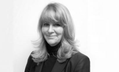 black and white photo of smiling woman with long blonde hair