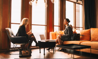 Two women in discussion, office scene